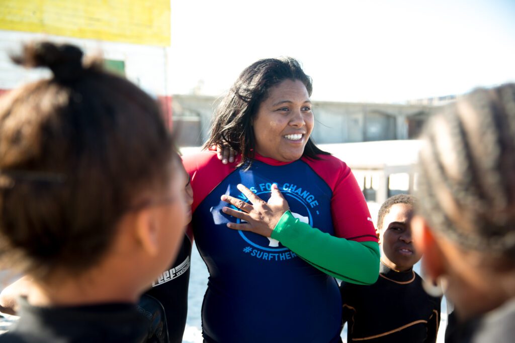 Melreen Devilliers from Waves For Change smiling with her hand on her chest